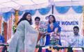 Ms. Naresh Yadav is presenting a bouque to Member, Charu WaliKhanna.Ex-Member, NCW Ms. Yasmin Abrar is standing on her right